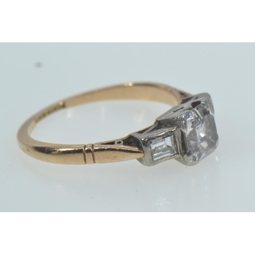 113 - 18ct gold, platinum & emerald-cut diamond trilogy ring, the centre stone weighing approximately ... 