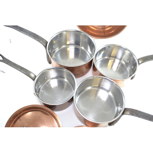 297 - Four Bourgeat stainless steel lined copper lidded saucepans inc. 18, 2x16 and 14, together with a co... 