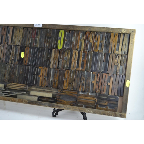 298 - Wooden printers' tray and print blocks, 82 x 36cm