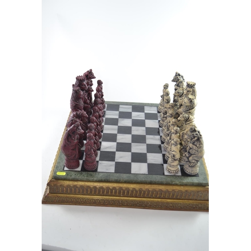 299 - Resin Reynard the Fox inspired chess pieces, together with Compton and Woodhouse marble chess board,... 