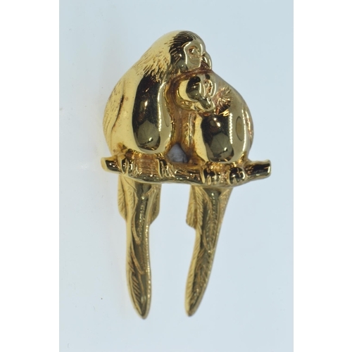 60 - 9ct gold brooch, modelled as a pair of parakeets on a branch, length 47mm, 12.1 grams