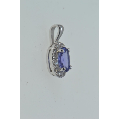 88 - 18ct white gold cluster pendant set with diamonds surrounding a central blue stone, possibly kyanite... 