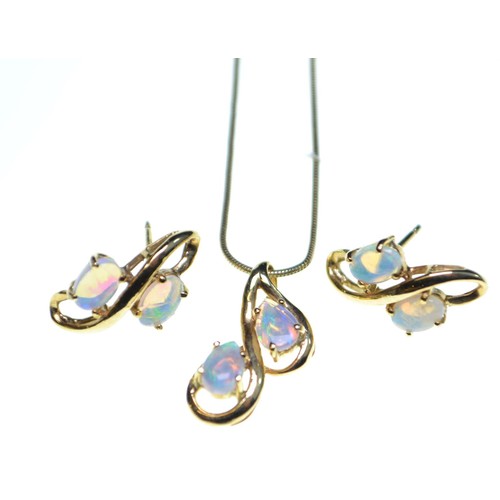 87 - Opal parure, comprising: a pendant on a 9ct gold chain; a ring, size Q, and a pair of earrings (no b... 