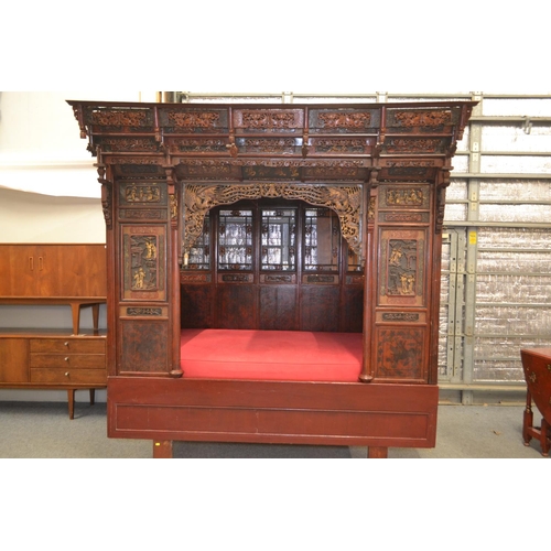 528 - An impressive Chinese carved hardwood marriage bed. Length 230cm x 224cm high x 170cm wide. Breaks d... 