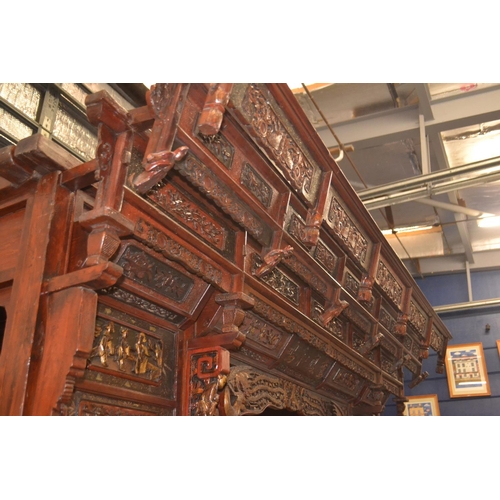 528 - An impressive Chinese carved hardwood marriage bed. Length 230cm x 224cm high x 170cm wide. Breaks d... 