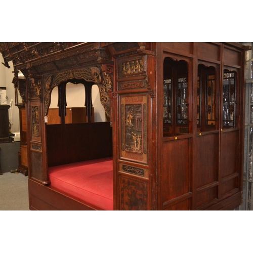 528 - An impressive Chinese carved hardwood marriage bed. Length 230cm x 224cm high x 170cm wide. Breaks d... 