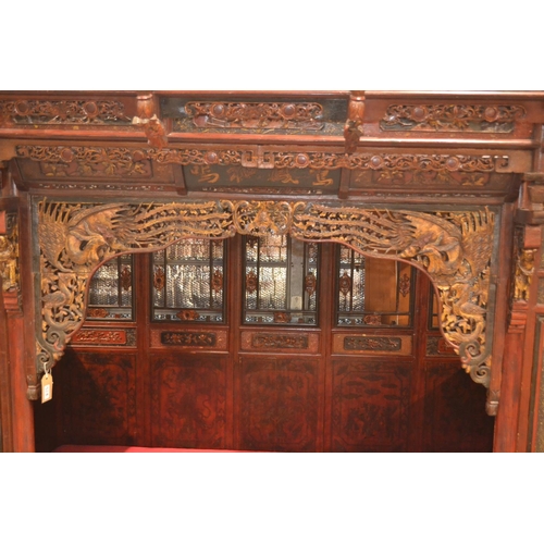 528 - An impressive Chinese carved hardwood marriage bed. Length 230cm x 224cm high x 170cm wide. Breaks d... 