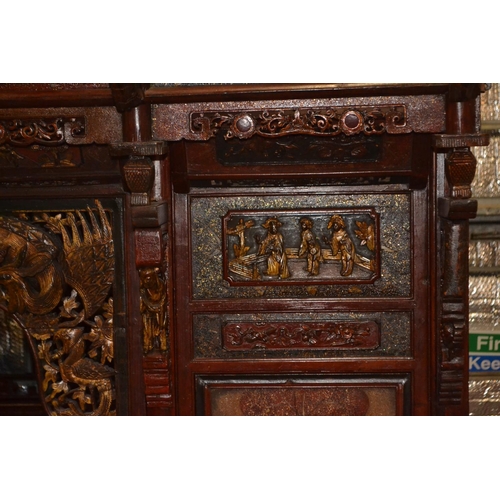 528 - An impressive Chinese carved hardwood marriage bed. Length 230cm x 224cm high x 170cm wide. Breaks d... 