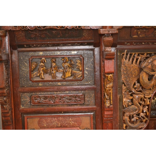 528 - An impressive Chinese carved hardwood marriage bed. Length 230cm x 224cm high x 170cm wide. Breaks d... 