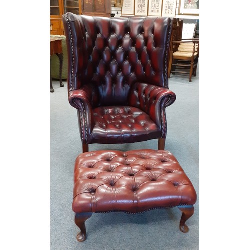 529 - Oxblood barrel backed Chesterfield library armchair W80cm H112cm with footstool W68cm D51cm H30cm.