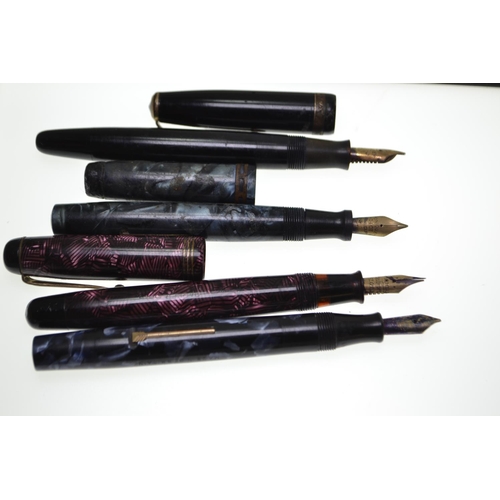 701 - Four vintage fountain pens; a marbleised pink Parker Televisor pen with 14ct gold Conway Stewart nib... 