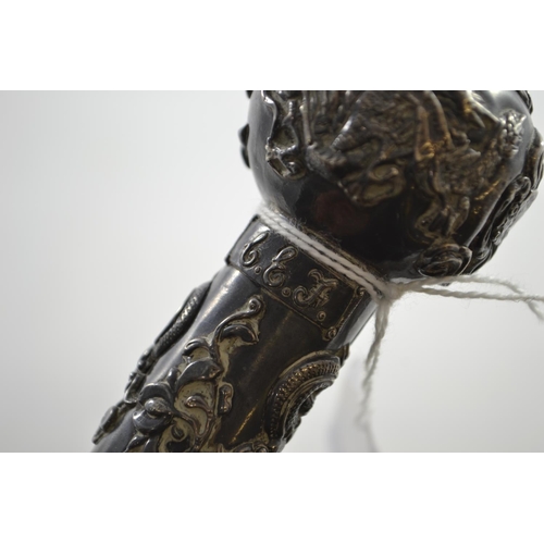 715 - 1925 white metal topped walking cane depicting dragons, fish and crab,  initialed G.E.J., lengt... 