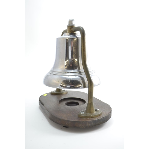 720 - A Mid-C20 Fire Engine Bell, with chrome finish on brass frame, mounted on wooden stand. Bell D25.5cm... 