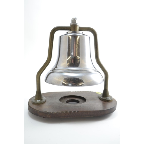 720 - A Mid-C20 Fire Engine Bell, with chrome finish on brass frame, mounted on wooden stand. Bell D25.5cm... 