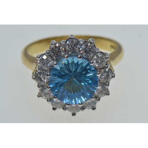 731 - 18ct gold, blue topaz & diamond cluster ring, size N, 6.63 grams