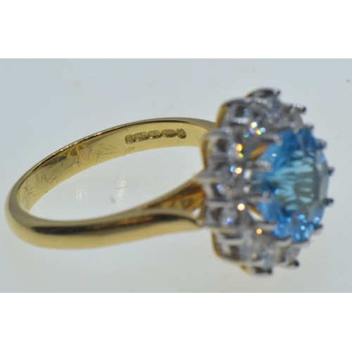 731 - 18ct gold, blue topaz & diamond cluster ring, size N, 6.63 grams