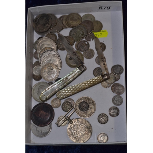 679 -  Two silver fruit knives plus pre-1947 silver coins 321grams in total and WW2 Defence metal.