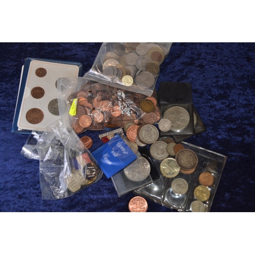 691 - British and world coins plus some badges, Inc 1888 half crown and 1945 and 1938 two shilling coins.