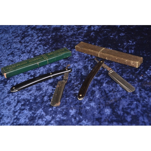 698 - Two cut throat razors, William Rodgers express and Trafford Brand.