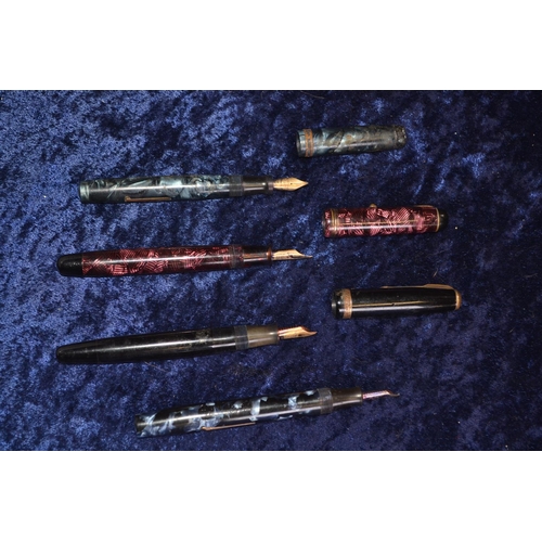 701 - Four vintage fountain pens; a marbleised pink Parker Televisor pen with 14ct gold Conway Stewart nib... 