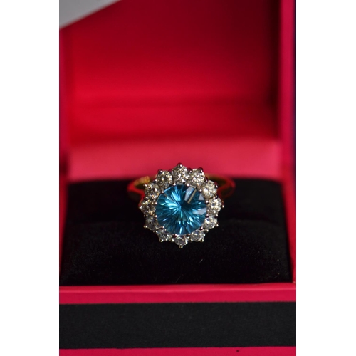 731 - 18ct gold, blue topaz & diamond cluster ring, size N, 6.63 grams