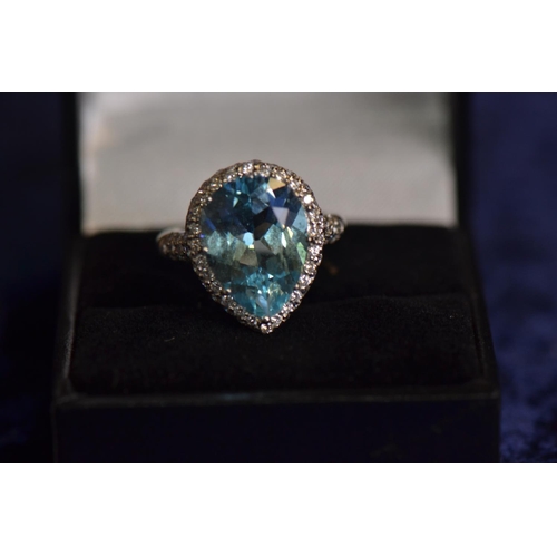 742 - 18ct white gold, blue topaz & diamond cluster ring, size L1/2, 8.15 grams