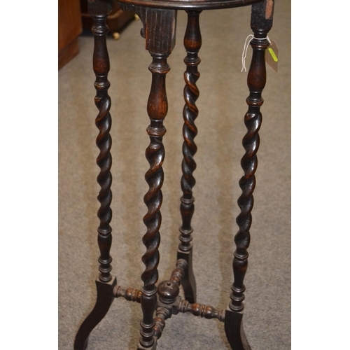 1128 - Oak barley twist jardinière stand, with cross stretcher support. Height 104cm x diameter 35cm... 