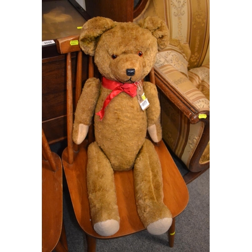 1023 - Large early C20th mohair teddy bear, wood wool stuffed with articulated limbs, approx 70cm length