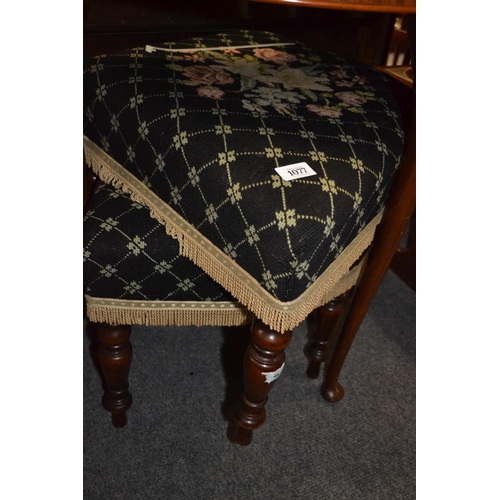 1077 - Pair of upholstered foot stools on turned legs.