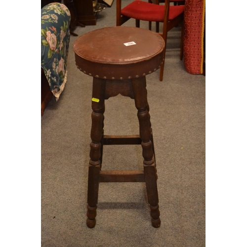 1141 - Leather topped studded bar stool. dia 32 h 79cm