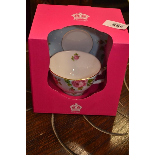 886 - Boxed Royal Albert tea cup and saucer.  Pool vase 16.5cm