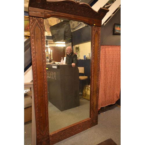 902 - Balinese carved mahogany mirror. 122cm wide x 210cm high