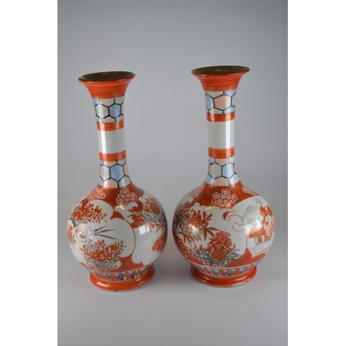 906 - Pair of oriental vases 24cm high, large chip to one rim, marks to base.