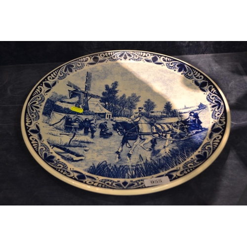 955 - Delfts Blauw wall charger, depicting a winter ice skating scene, diameter 39.5cm