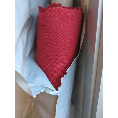 121A - Roll of red fabric, width 138 cms, length unknown