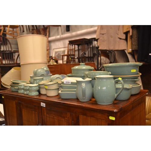 301 - Large collection of Denby serving ware, cups, mugs and soup bowls & ramekins.