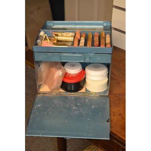 77 - Blue metal box with vintage stage makeup materials, brushes etc.