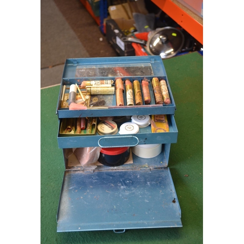 77 - Blue metal box with vintage stage makeup materials, brushes etc.