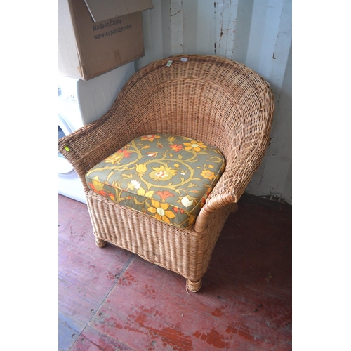 102 - Wicker conservatory armchair with floral cushion