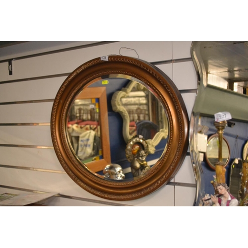 233 - Oval bevelled mirror. W61 x H 51 cm