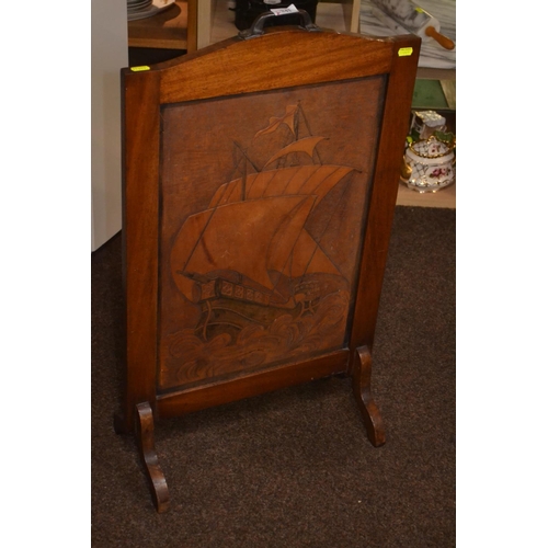 241 - Fire screen with carved ship on one side. W 48 x H 83 cm