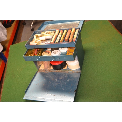 77 - Blue metal box with vintage stage makeup materials, brushes etc.