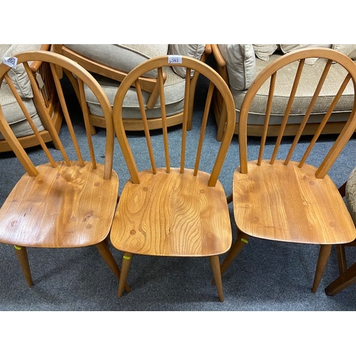 593 - Four blonde Ercol dining chairs, stamps to some chairs clearly marked.