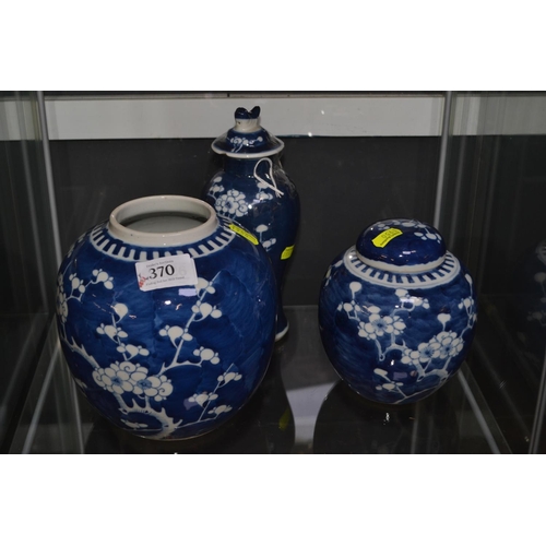 370 - Three Chinese blue and white prunus pattern vessels, with blue circles mark to base, highest 22cm