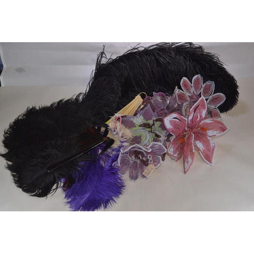 388 - Ostrich feathers and feathered fans & flower decorations