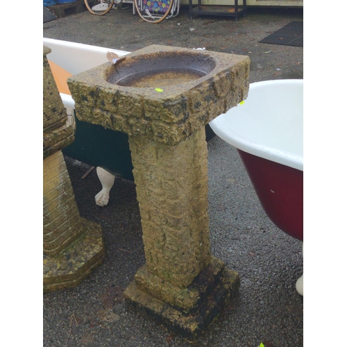 14 - Concrete brick effect bird bath. Breaks down into 2 parts. Small crack to top bath section. H84cm