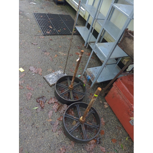 34 - Pair of cast wheels together with metal drill pillar