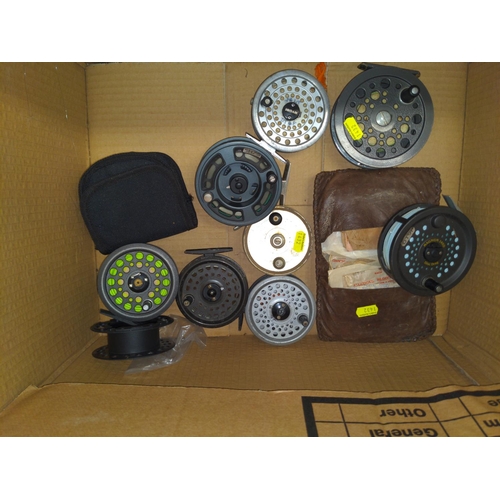 112 - Box of fishing reels inc. Ryobi, Magnum, Trutta, intrepid and Diawa plus flies etc.