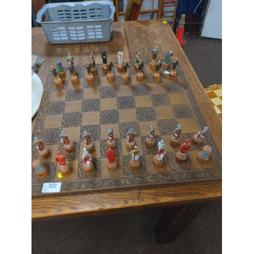 322 - Crusaders v Saracens lead figure chess pieces with wooden chess board W 46 CM