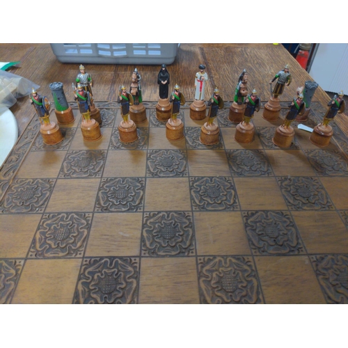 322 - Crusaders v Saracens lead figure chess pieces with wooden chess board W 46 CM